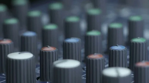Male fingers turning equalizer knobs on mixer Video stock 84991255