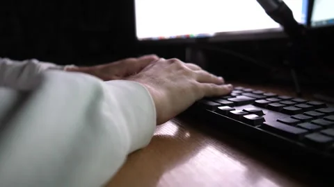 Male fingers typing text on computer keyboard at evening. Guy working Stock Footage 306740738