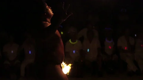 Male fire dancer juggles fire ring, throws and misses Video stock 68101304