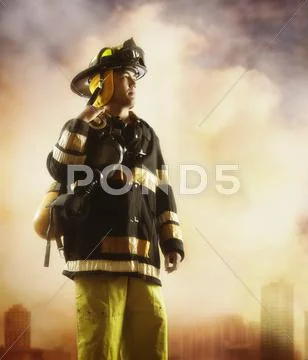 Male fire fighter with smoky background Stock Photos
