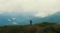 The male with the firestick standing on the mountain top 4k or 4k+ Resolution