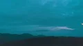 The male with a firework stick standing on the night mountain 4k or 4k+ Resolution