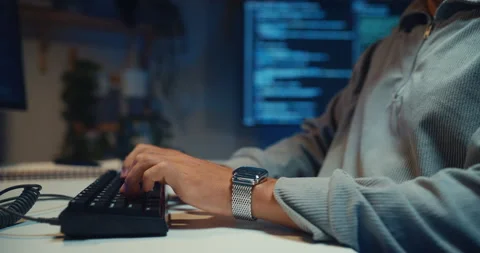 Male freelance developer typing write prompt AI bot coding at office night. Vídeo Stock 347148386