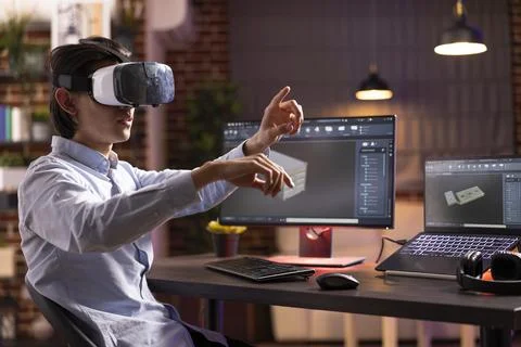 Male freelancer developing digital container with virtual reality headset Stock Photos