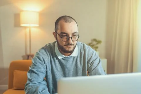 Male freelancer or IT code developer working at laptop. Programmer or young Stockfoto's