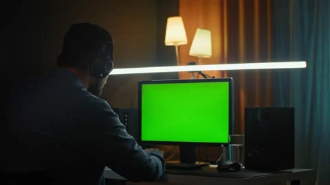 Male freelancer using personal computer with wide big display and laptops Stock Footage 169865334