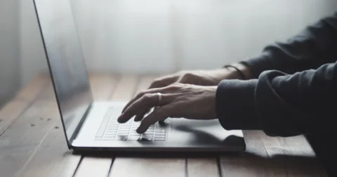 Male freelancer working on laptop at home-office. Stock Footage