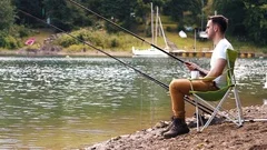 Men Fishing Rod Sitting Fishing Chair Stock Photo by ©gpointstudio