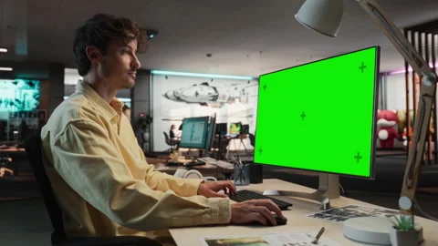 Male Game Developer Using Chromakey Computer In Office Stock Footage 255795629
