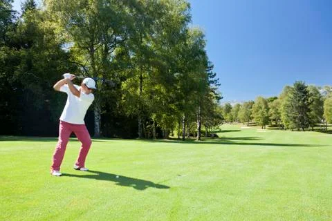 Male golf player performs a swing. summer outdoor spo Stock Photos