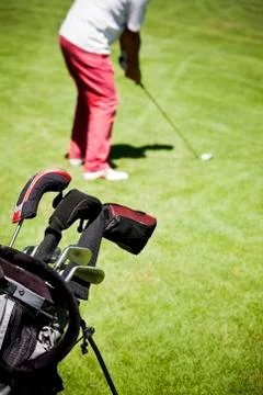 Male golf player performs a swing. summer outdoor spo Stock Photos