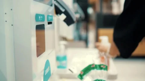 Male Grocery store worker doing checkout scanner for customer shopping cash Stock Footage 334644778