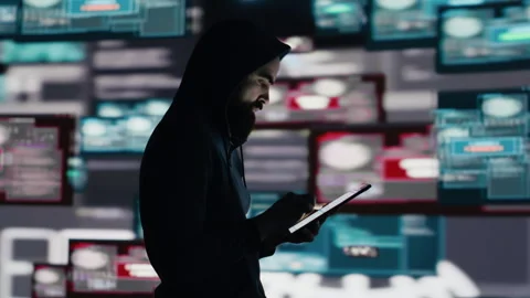 Male hacker breaking into a system in stealth mode by programming code Stock Footage 311082567