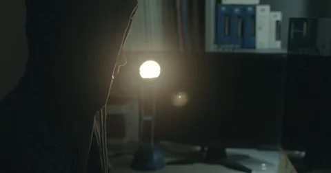 Male hacker in dark office doing cyber crime Stock Footage 78037562