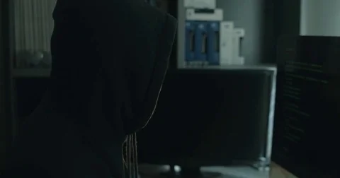 Male hacker in dark office doing cyber crime Stock Footage 78037588