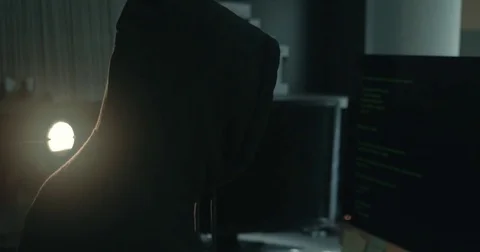 Male hacker in dark office doing cyber crime Stock Footage 78037653