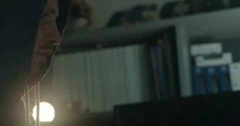Male hacker in dark office doing cyber crime Stock Footage 78037676