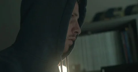Male hacker in dark office doing cyber crime Stock Footage 78037706