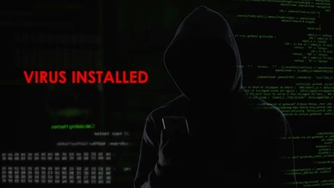 Male hacker installed virus on enemy laptop, malicious software computer program Stock Footage 84530311