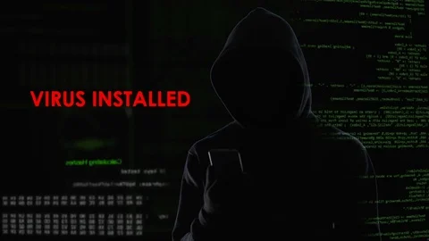 Male hacker installed virus on enemy laptop, malicious software computer program Stock Footage 84536142