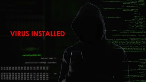 Male hacker installed virus on enemy laptop, malicious software computer program Stock Footage 84539161
