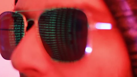 Male Hacker Looking at Computer Code With Mirror Screen Reflection on 動画素材 139446647