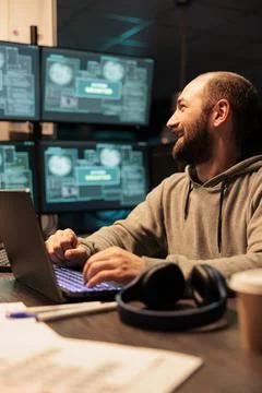 Male hacker stealing computer data from server Stock Photos
