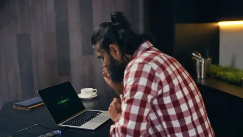 Male hacker successfully breaching computer system to steal sensitive data Stock Footage 313281712