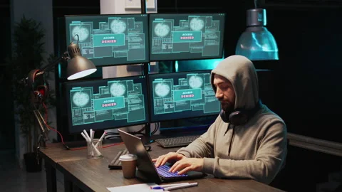 Male hacker thief breaking through cyber security server 動画素材 224577129