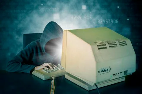 Male hacker typing on keyboard with binary code Stock Photos