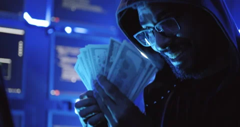 A male hacker is using a computer to hack data to demand ransom from victims.	 Stock Footage 221739306