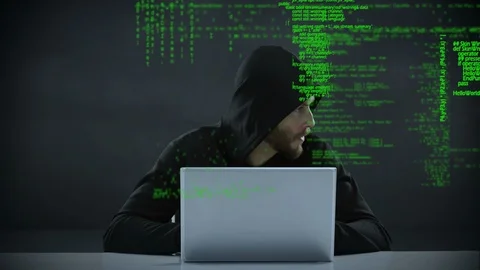 Male hacker using a laptop Stock Footage 107676450