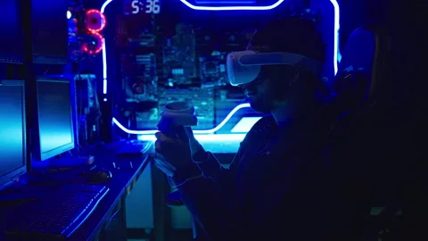 Male hacker wearing vr in his hacking room. Stock Footage 229876404