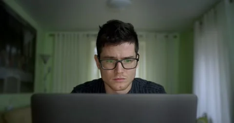Male hacker working on a computer for cyber attack while green binary hacking Stock Footage 135615324