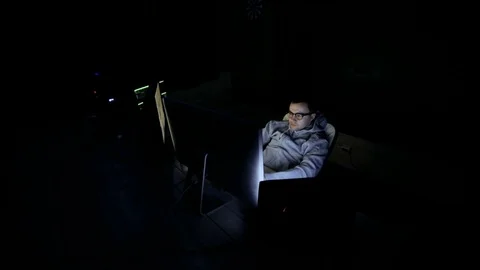 Male hacker working on a computer. hacker in glasses is working on computer in Stock Footage 83877836