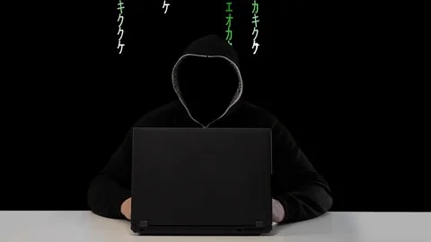Male hacker working on a computer vs Green Matrix code on background Video stock 83778905