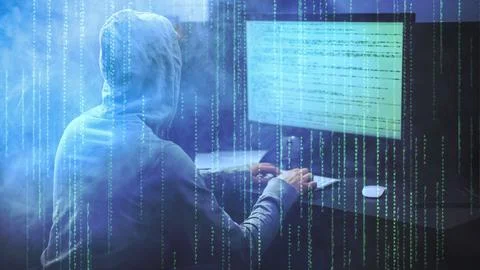 Male hacker working on a computer vs Green Matrix code and smoke on backgroun Stock Photos