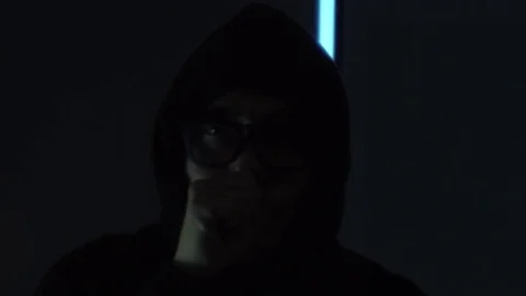 Male hacker working on a VR computer while scanning finger with green code Vídeos de archivo 79809355