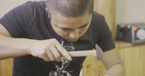 Male hammering object Stock Footage 141362498