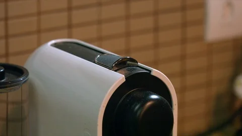 Male hand adding a coffee pod in the automatic coffee machine. Macro shot Stock Footage 115714963