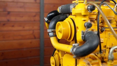 A male hand adding gas to an open boat engine in a workshop. HD video. Video stock 88399631