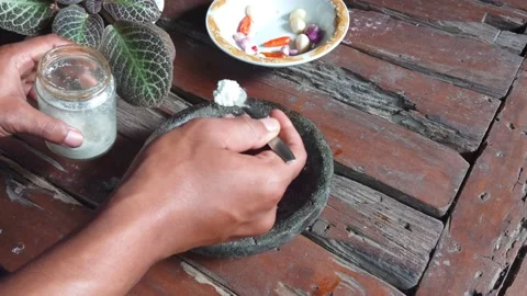 Male hand adding salt to spices for cooking fried rice. Preparing the food. Video stock 169041102
