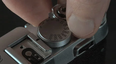Male hand adjusting the exposure in camera Stock Footage 58699489