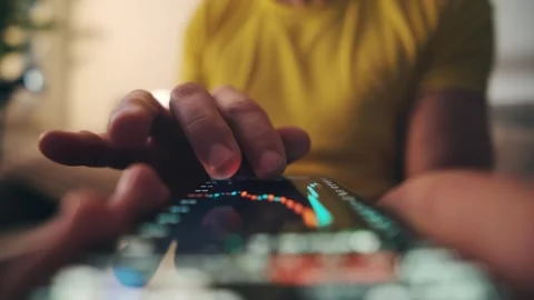 Male Hand Analyzing Financial Graph On Mobile Trading Application Stock Footage 336288196