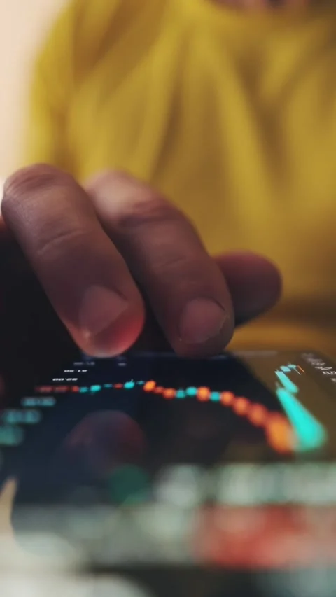 Male Hand Analyzing Financial Graph On Mobile Trading Application Stock Footage 339024222