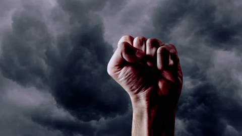 A male hand on the background of storm clouds Stock Footage 236478701