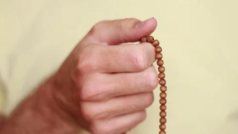 Male hand with beads 스톡 동영상 75048827