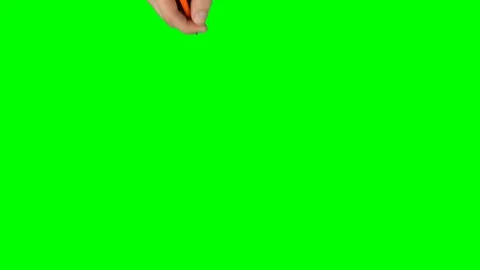 Male hand in a black sweater with orange pencil is writing on green screen Stock Footage 128695853