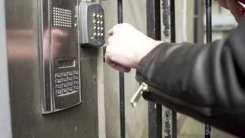 Male hand buzzing to get in building Stock Footage 133459759
