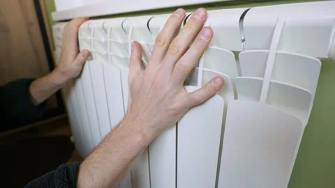 Male Hand Checking Temperature Of White Central Heating Radiator At Home Stock Footage 328277304